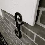 I love this wrought iron "S" shutter lock~